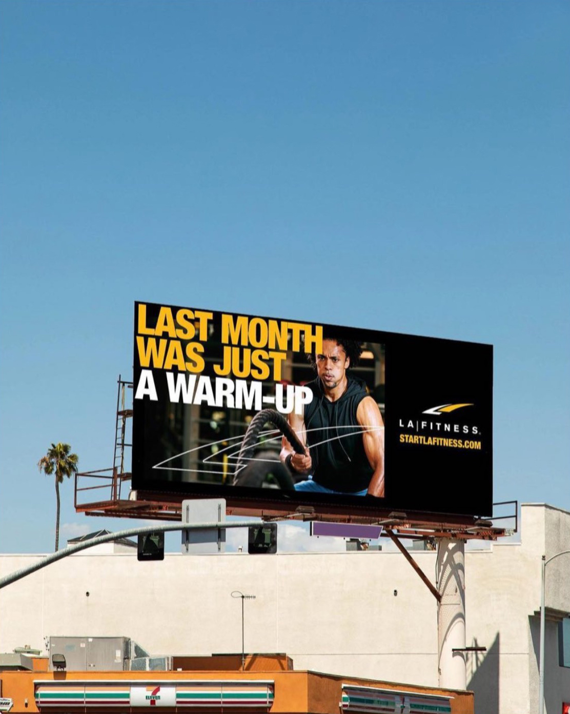 LA Fitness Billboard featuring an image by Caleb Kuhl of an african american man doing a ropes workout